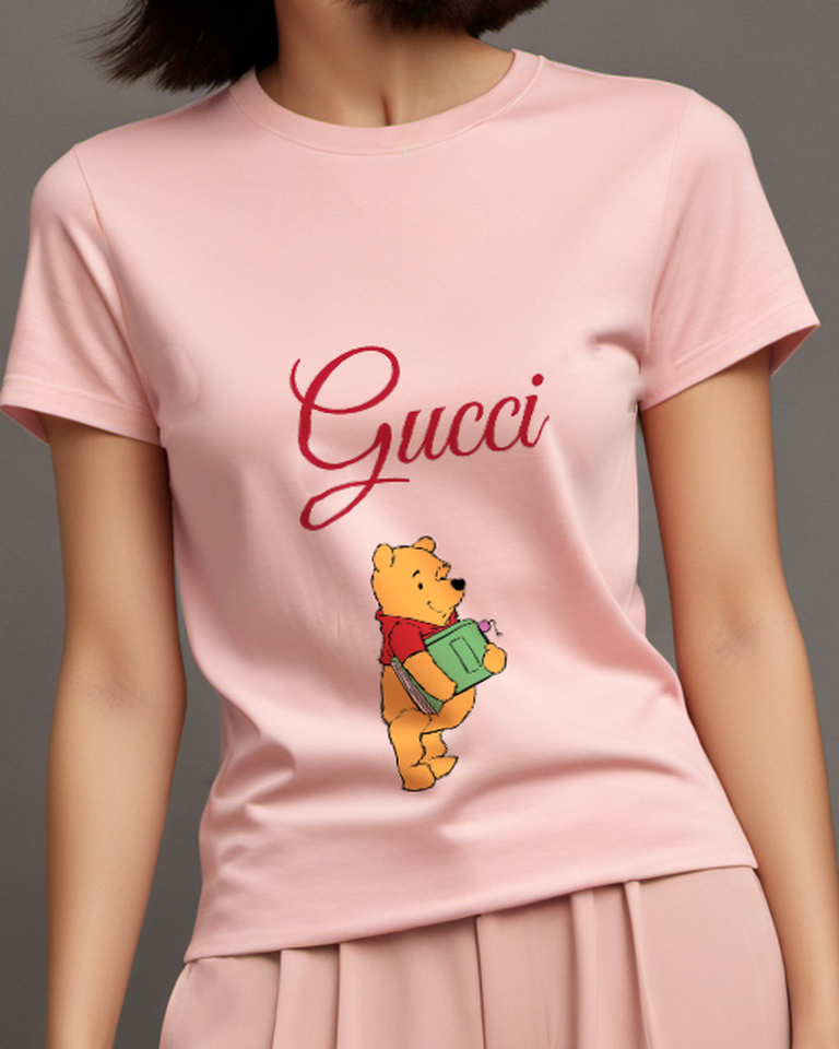 Blush Pink Winnie The Pooh Holding A Green Book Graphic T-Shirt - model wearing view