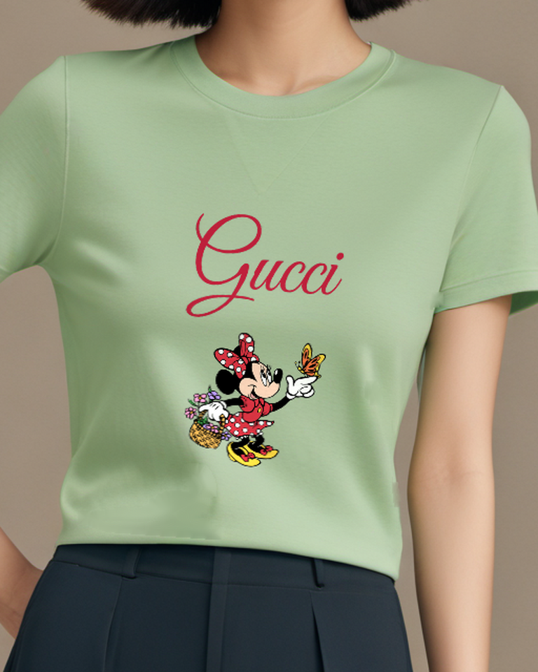 Sage Green Minnie Mouse Pointing At Butterfly Graphic T-Shirt - model wearing view