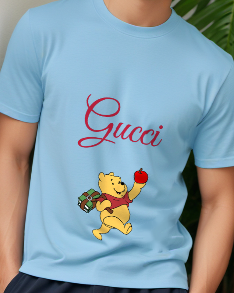 Sky Blue Winnie The Pooh Holding Apple And Books Graphic T-Shirt - model wearing view