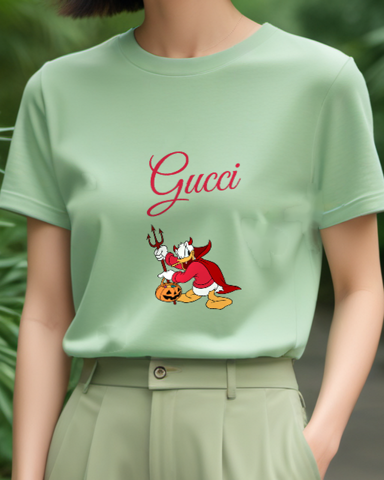 Sage Green Donald Duck In Devil Costume Holding Trident And Pumpkin Graphic T-Shirt - model wearing view