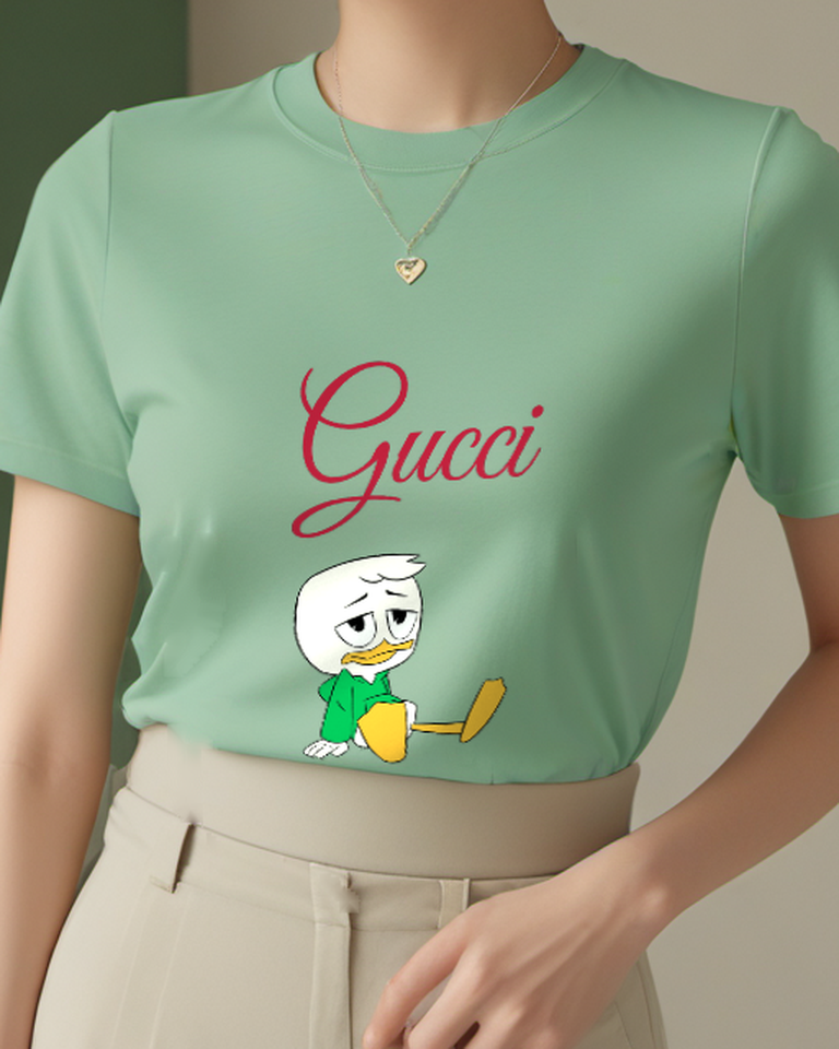 Sage Green Louie Duck Sitting Cross Legged Graphic T-Shirt - model wearing view