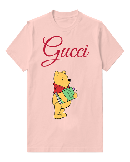 Blush Pink Winnie The Pooh Holding A Green Book Graphic T-Shirt - front product view