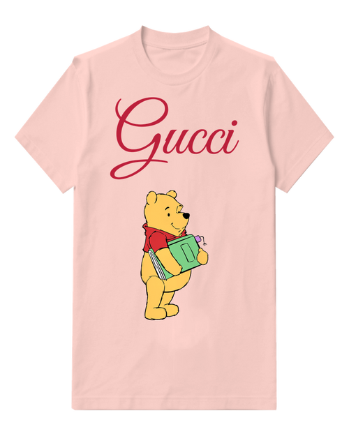 Blush Pink Winnie The Pooh Holding A Green Book Graphic T-Shirt - front product view