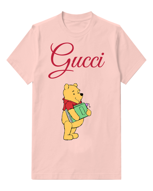 Blush Pink Winnie The Pooh Holding A Green Book Graphic T-Shirt - front product view