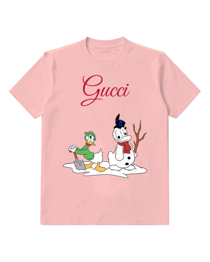 Blush Pink Donald Duck Shovels Snow Beside Snowman Graphic T-Shirt - front product view