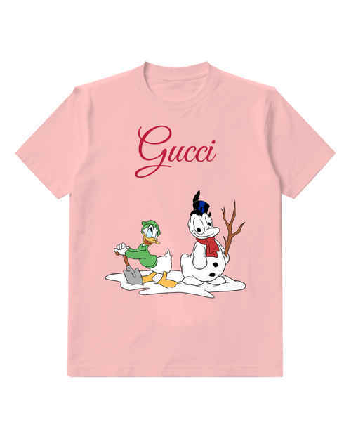 Blush Pink Donald Duck Shovels Snow Beside Snowman Graphic T-Shirt - front product view